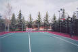 Full size multi-use tennis court in Priddis, AB